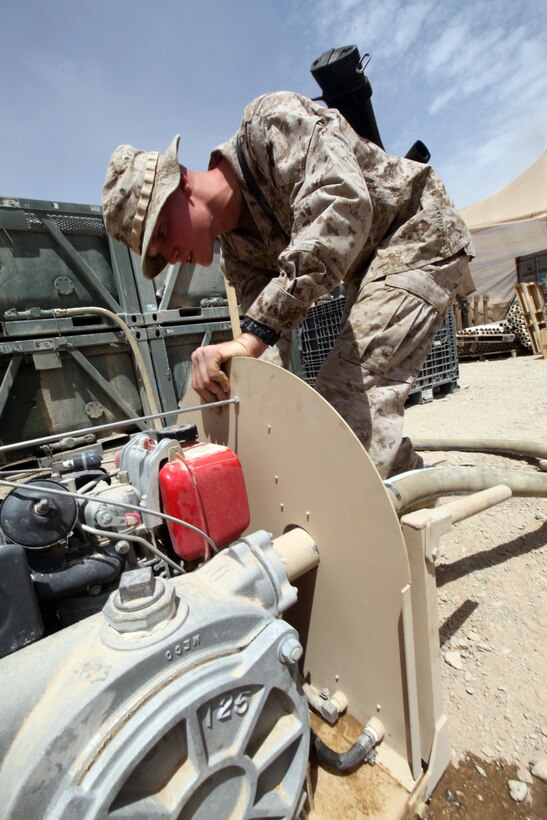 Lance Cpl. Trevor D. McNally, water support technician for 9th Engineer Support Battalion, 1st Marine Logistics Group (Forward), tests out a water pump at Camp Leatherneck, Afghanistan, Aug. 4. McNally, 20, from Hinckley, Minn., was selected by I Marine Expeditionary Force (Forward) as the Marine of the Quarter for the third quarter of calendar year 2010. He was awarded the Navy and Marine Corps Achievement Medal by Brig. Gen. Charles L. Hudson, 1st MLG (FWD) commanding general.