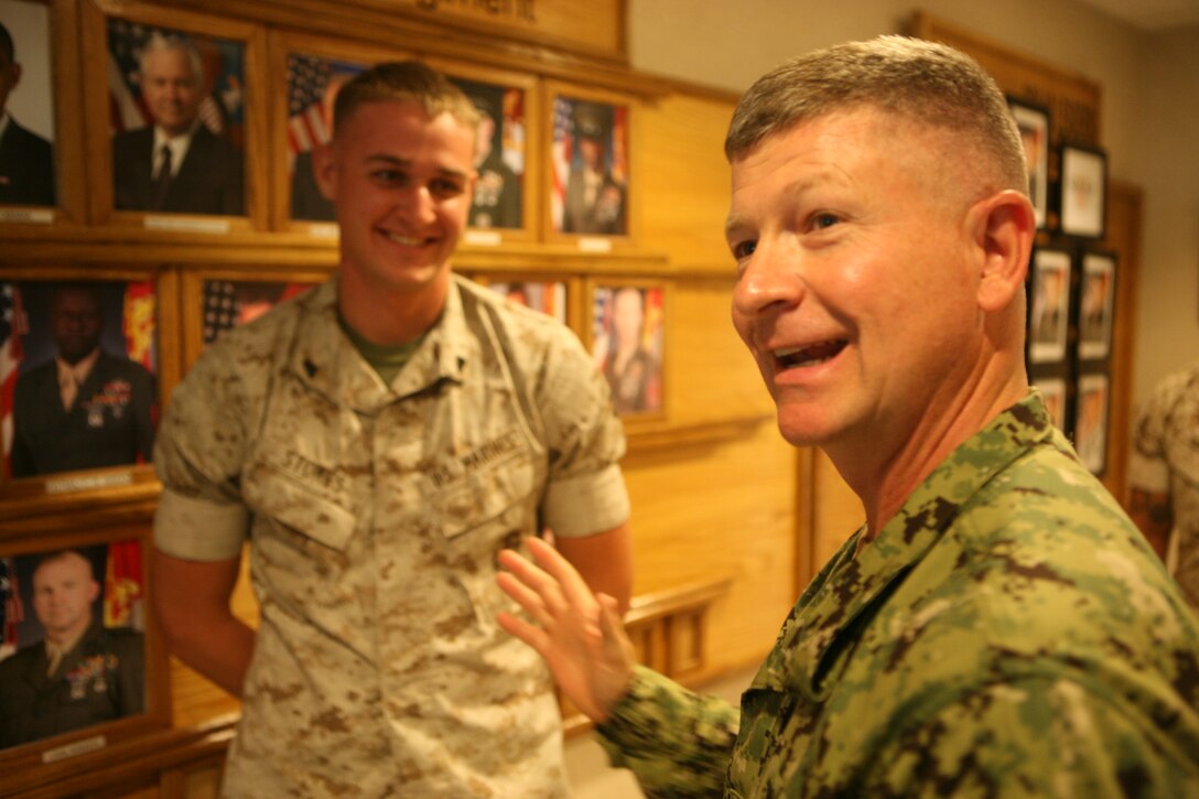The master chief petty officer of the Navy, Master Chief Petty Officer Rick D. West, speaks to a Marine during his tour through the 3rd Battalion, 9th Marine Regiment, battalion aid station aboard Marine Corps Base Camp Lejeune, Aug. 3, 2010. The MCPON spent two days meeting sailors and visiting different areas throughout the base.