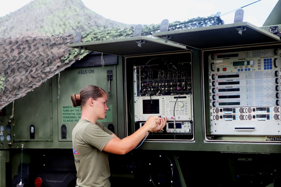 Cpl. Chelsea Sanchez, a satellite operator with the 31st Marine Expeditionary Unit, works on a Phoenix Tactical Satellite Terminal during the 31st MEU’s COMEX, Aug 5. COMEX is being conducted in support of the MEU’s fall patrol. (Official Marine Corps photo by Cpl. Michael A. Bianco)