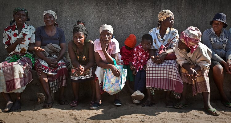 Mozambicans waits to be seen by U.S. military medical personnel during a medical engagement Aug. 5, 2010, in Tenga, Mozambique. The villagers were offered optometry and dental care, along with basic medical assistance as part of Exercise Shared Accord 2010, a 10-day exercise designed to increase U.S. Africa Command partner nation capacity for peace and stability operations. Adequate medical care is hard to come by in Mozambique. It is a country that has an average life expectancy of 41 years due to the impact of preventable and treatable diseases like malaria, HIV/AIDS and tuberculosis.