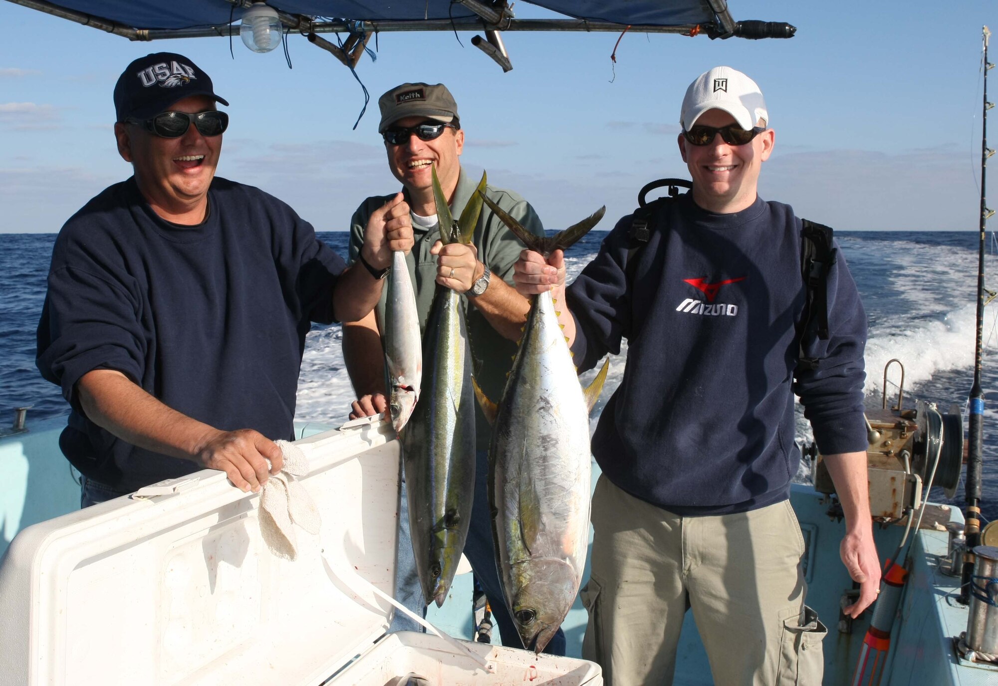 Chief Master Sgt. Michael P. Donoven, Col Kelly Fletcher and ??? display their catches during a fishing trip Dec. 20, 2008 in the waters off of Okinawa, Japan. Chief Donoven, the former 18th Mission Support Group Superintendent, passed away Aug. 4 in Arkansas. The Chief retired June 9, after 25 years of service to the United States Air Force (Photo courtesy of Mr. Chip Steitz)