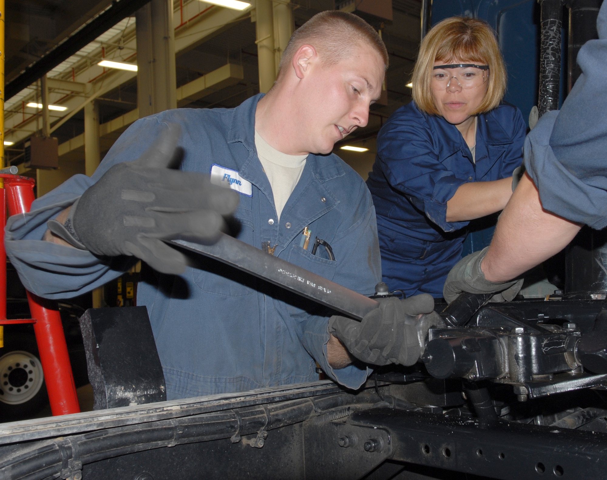 VANDENBERG AIR FORCE BASE, Calif.-- Staff Sgt. Brian Flynn, a 30th Logistic Readiness Squadron vehicle and equipment technician tightens a pipe on a hydraulic cylinder on a Sterling dump truck here Thursday, Aug. 5, 2010. Colonel Boltz and Chief Johnson will be partaking monthly in activities within Team V's work centers. (U.S. Air Force photo/Senior Airman Antoinette Gibson)


