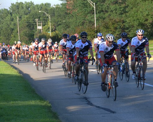 Members of the Air Force Cycling Team near the top of the first hill of the day as they begin to pedal across Iowa during The Register's Annual Great Bicycle Ride Across Iowa, also known as RAGBRAI. Riders from throughout the Air Force came to Sioux City, Iowa, located on the Missouri River to the west, to start their trek that would take them seven days and 442 miles east to get to Dubuque, Iowa, and the Mississippi River.  (U.S. Air Force photo)