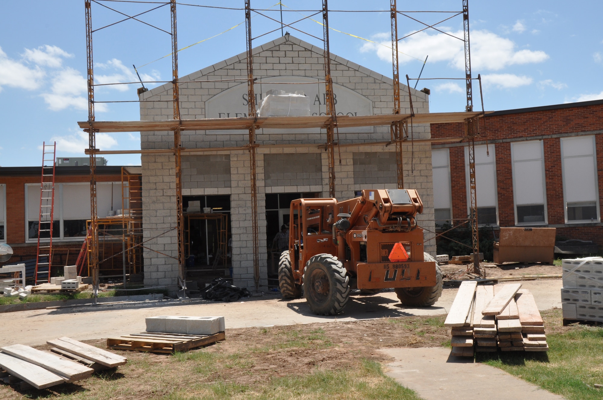 Bulldozers and construction crews renovate the exterior of the elementary school at Sheppard Air Force Base, Texas July 30.  Improvements to the entry, driveway, clinic, classrooms, hallways and electrical systems evolved from a 2006 Wichita Falls School Bond election which delivered $1.5 million for an the upgrades to Sheppard Air Force Base Elementary.  (U.S. Air Force photo/Debi Smith) 