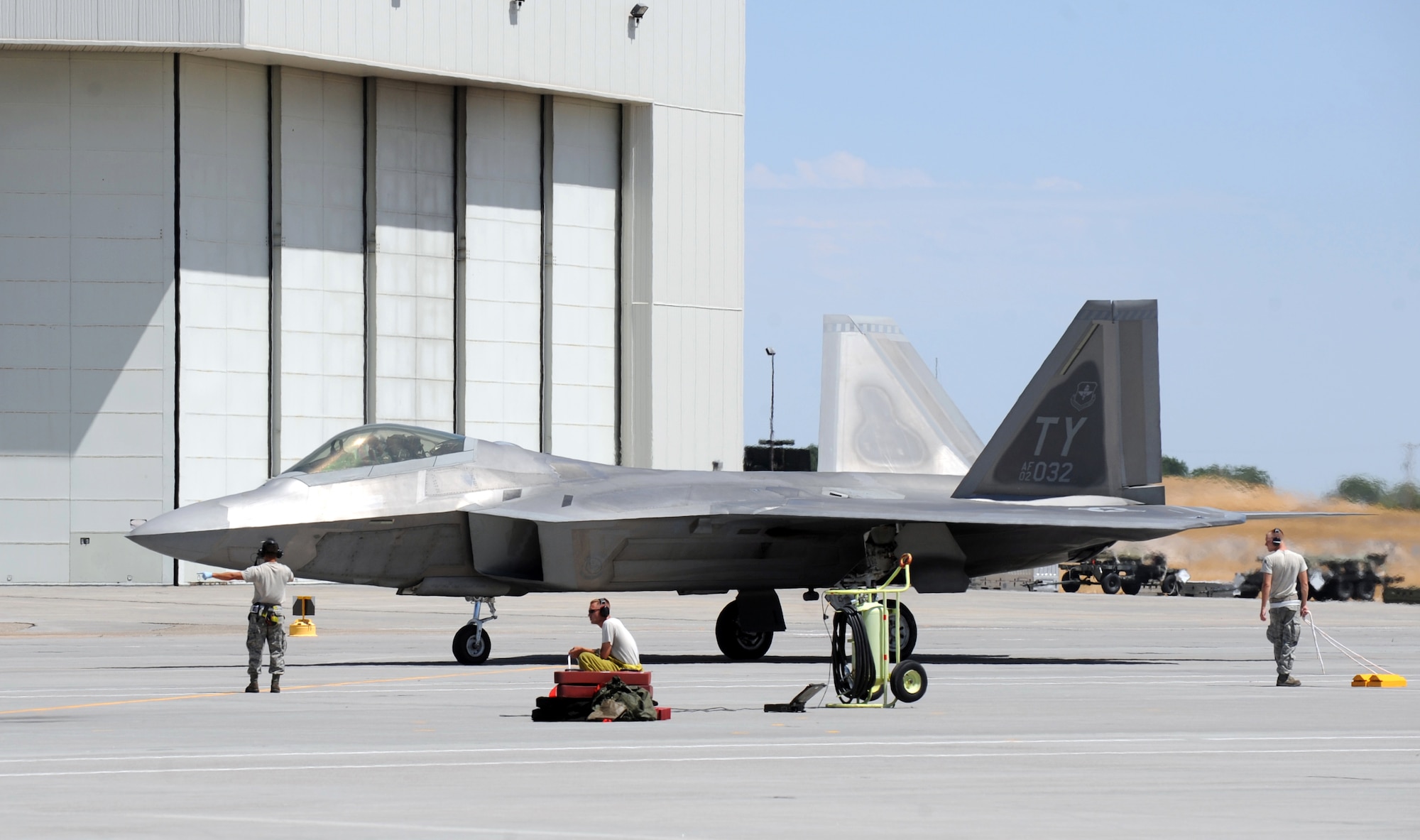 MOUNTAIN HOME AIR FORCE BASE, Idaho -- Crew chiefs from the 43rd Aircraft Maintenance Unit out of Tyndall AFB, Fla., receives an F-22 Raptor after its landing July 29. More than 150 Airmen and 12 F-22 Raptors from the 43rd Fighter Squadron at Tyndall AFB, arrived in support of the Air Force’s first Operation Global Gem joint multi-service training. Global Gem is being conducted here from Aug. 2 to Sept. 2 and is primarily focused on conducting F-22 Raptor training missions with Marine F-5s and Air Force F-15Es. (U.S. Air Force photo by Airman 1st Class Debbie Lockhart)