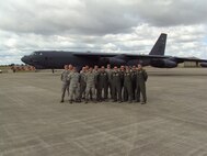 FARNBOROUGH, United Kingdom --  A group of Airmen from Minot AFB pose for a picture in front of B-52H Stratofortress 61-0039 recently. The group represented the base at the 2010 Farnborough International Air Show which came to a close July 25. Members of the group are Lt. Col. Robert Billings, Maj. Virgil Carter, Capt. Jeffery Orr, Capt. Brandon Wheeler, Capt. James Carmichael, 1st Lt. Charles Sigman, Senior Master Sgt. Curtis Jensen, Tech Sgt. Kevin Arrington, Tech. Sgt. Trevor Getty, Tech. Sgt. Joashua Willard, Staff Sgt. Michael Wheeler, Senior Airman Stephen Simpson, Senior Airman Gilbert Herrera and Airman 1st Class Diego Sanchez-Gaona. Not pictured are Maj. David Lane and Capt. Dale Wilds. (Courtesy photo)