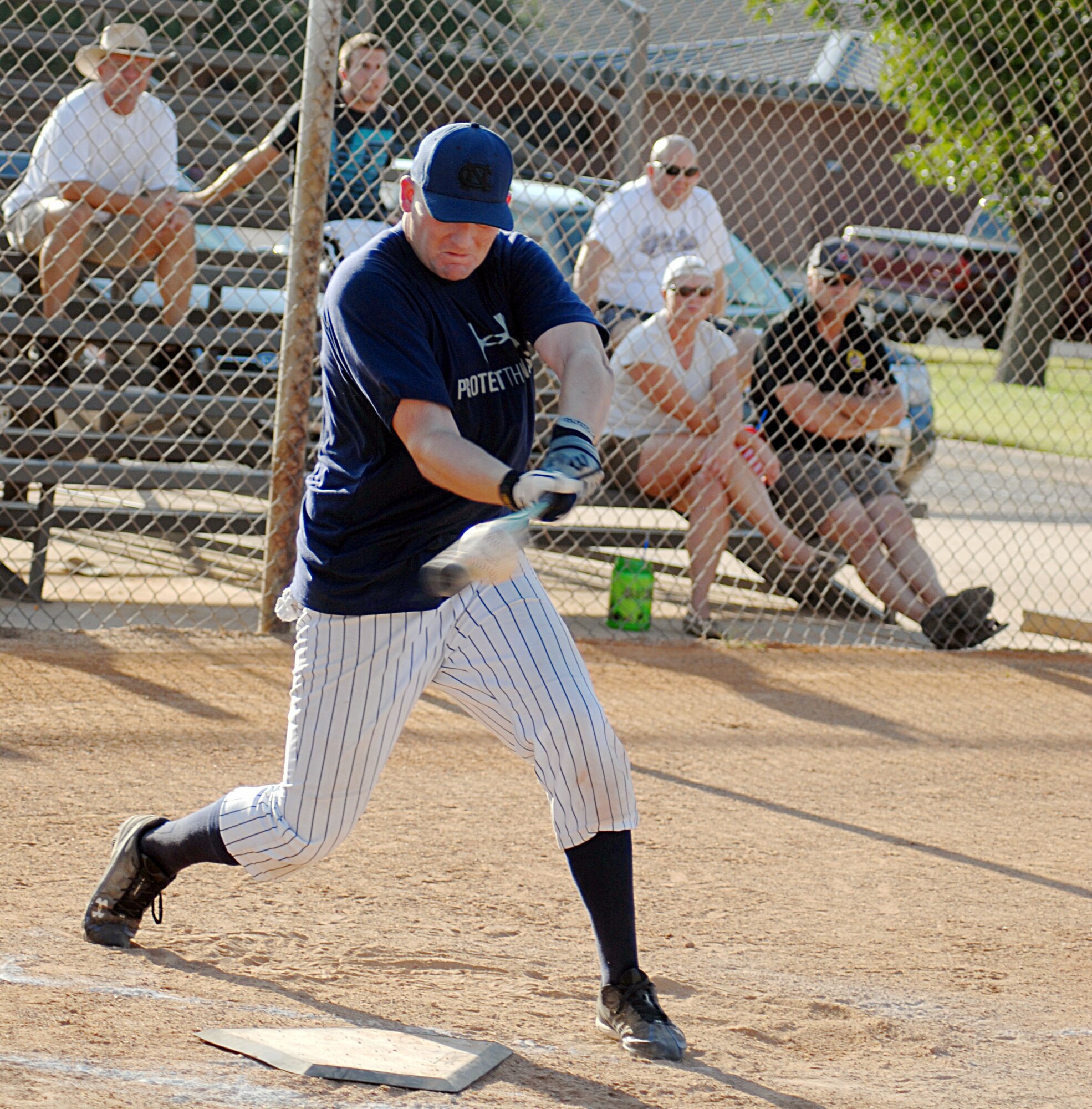 David Hill, 315th Training Squadron, knocks one into right field during the 2010 Intramural Softball championship game between the 315 TRS and 17th Mission Support Group Aug. 4. After a doubleheader, 17 MSG defeated 315 TRS, 15-12, taking the base championship. (U.S. Air Force photo/Connie Hempel)
