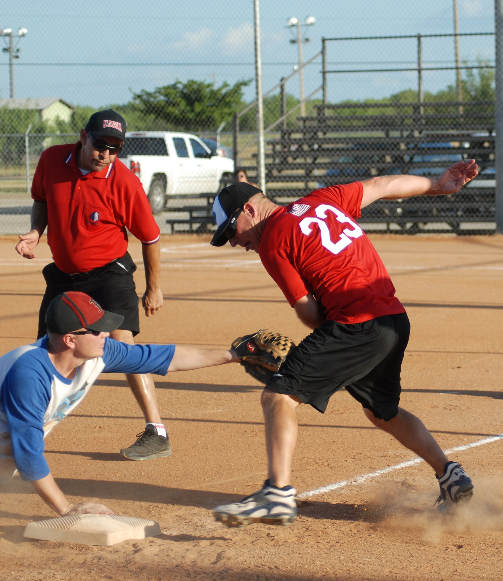 315th Training Squadron third baseman Steven Bartels tags Charlie Rehburg, 17th Mission Support Group, out despite Rehburg’s efforts to out maneuver him. The 17 MSG defeated 315 TRS, 17-11, after a doubleheader Aug. 4, taking the 2010 Intramural Softball championship, 15-12. (U.S. Air Force photo/Connie Hempel)