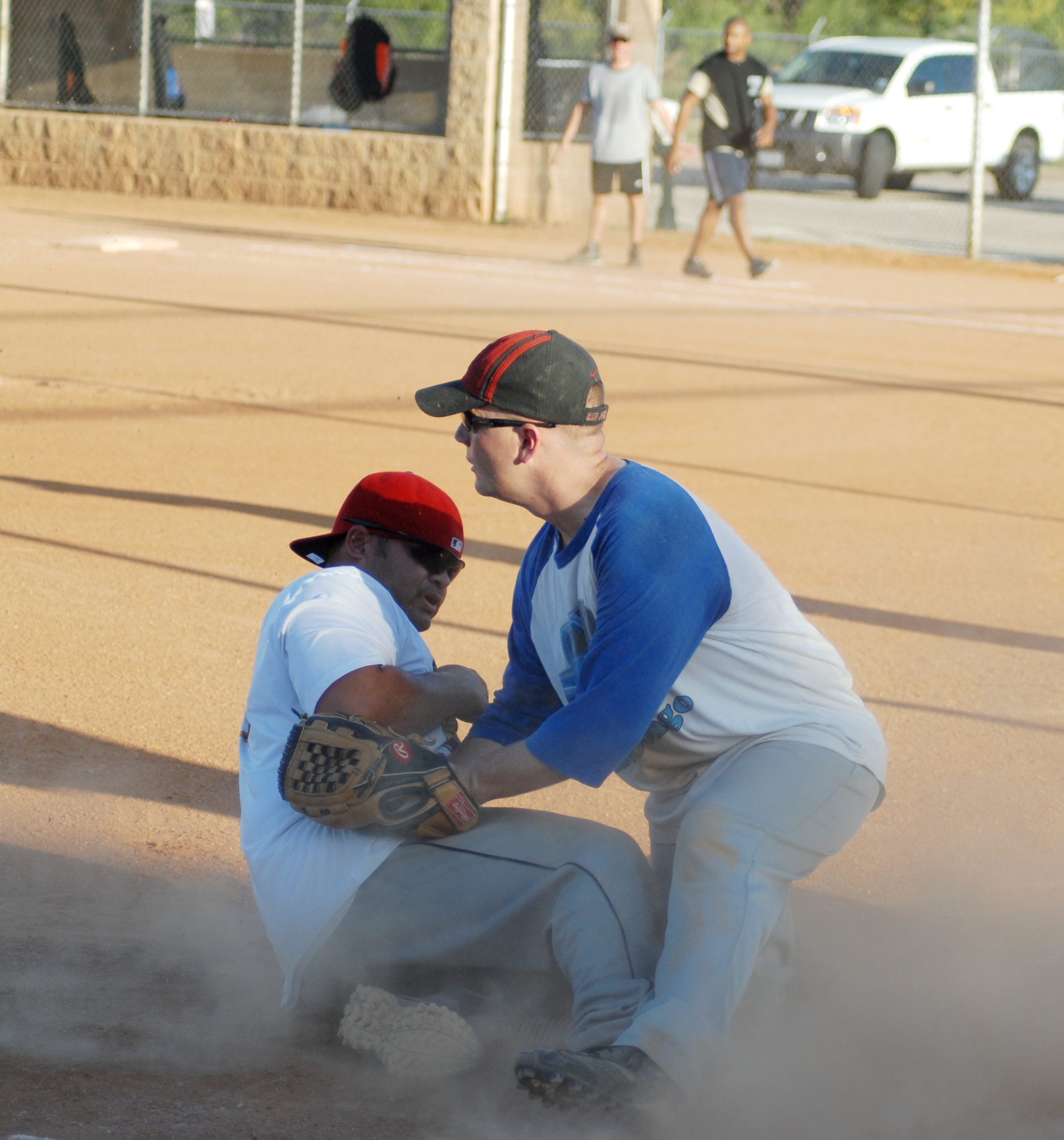 315th Training Squadron third baseman Steven Bartels, tags Omar Matos, 17th Mission Support Group, out as he slides to third during the 2010 Intramural Softball championship game Aug. 4. After a doubleheader, 17 MSG defeated 315 TRS, 15-12, taking the base championship. (U.S. Air Force photo/Connie Hempel)