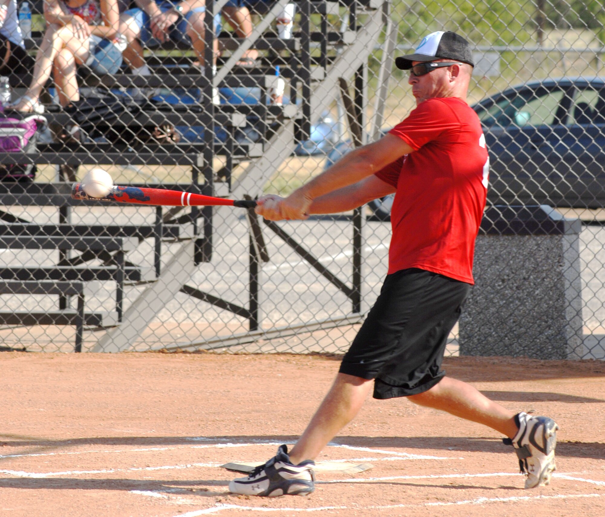 Charlie Rehburg, 17th Mission Support Group, hits a line drive during the 2010 Intramural Softball championship game between the 315th Training Squadron and 17 MSG Aug. 4. After a doubleheader, 17 MSG defeated 315 TRS, 15-12, taking the base championship. (U.S. Air Force photo/Connie Hempel)