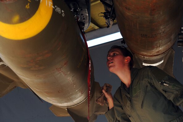 BARKSDALE AIR FORCE BASE, La. -- Capt. Jamie Denton, 20th Bomb Squadron aircraft commander, pre-flight checks a weapon on a B-52H Stratofortress during the Bucc Smoke competition Aug. 3. The 20th BS weapons and tactics, scheduling and training flights have worked closely to plan, schedule and design the tactical objectives for the competition. (U.S. Air Force photo by Senior Airman Brittany Y. Bateman)(RELEASED)