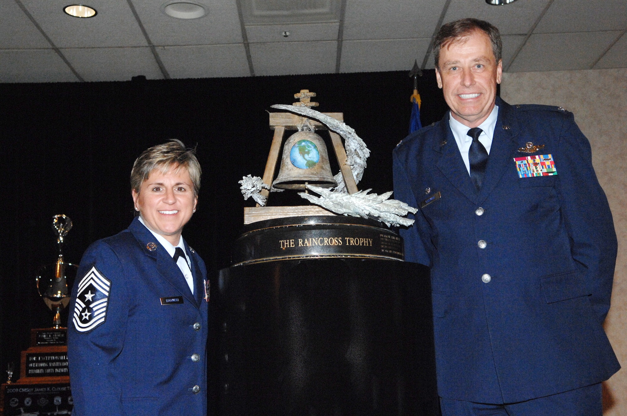 The 445th Airlift Wing, Wright-Patterson Air Force Base, Ohio, was awarded the Raincross Trophy at the 12th Annual Raincross Trophy Dinner July 22. Col. Stephen Goeman, Commander, and Chief Master Sgt. Peri Rogowski, Command Chief, accepted the award on behalf of the wing. The award is given to the best wing in 4th Air Force.  (U.S. Air Force photo/Tech. Sgt. Meredith Mingledorff)