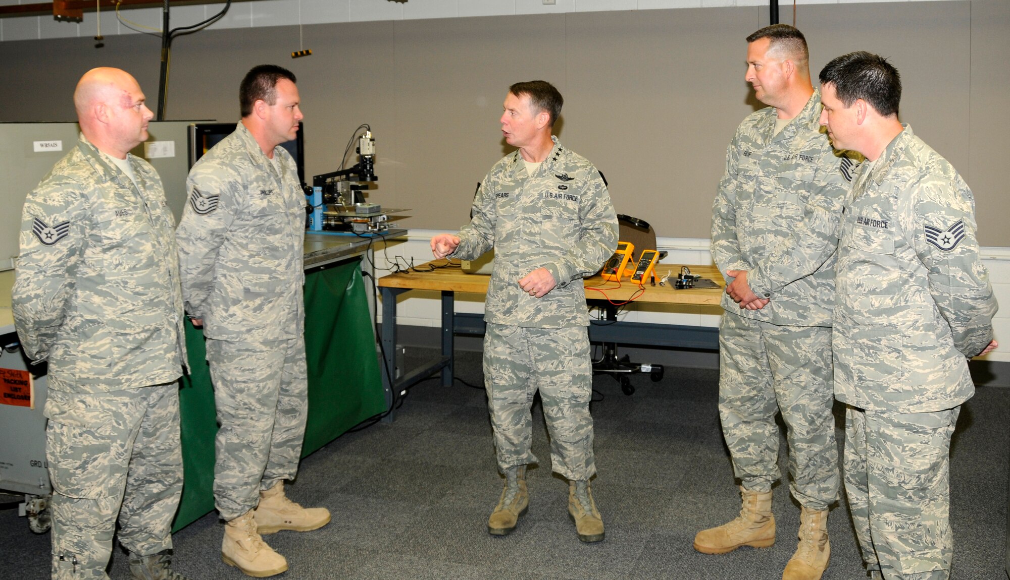 Lt. Gen. Glenn Spears, 12th Air Force and Air Forces Southern commander, middle, visits with members of the 188th Fighter Wing Avionics Intermediate Station, from left, Staff Sgt. Jeffery Ames, Tech Sgt. Derrick Phillips, Tech Sgt. Michael Reif and Staff Sgt. Robert Craise. The 188th AIS developed repairs that saved the Air Force approximately $1.3 million. (U.S. Air Force photo by Senior Master Sgt. Dennis Brambl/188th Fighter Wing Public Affairs). 