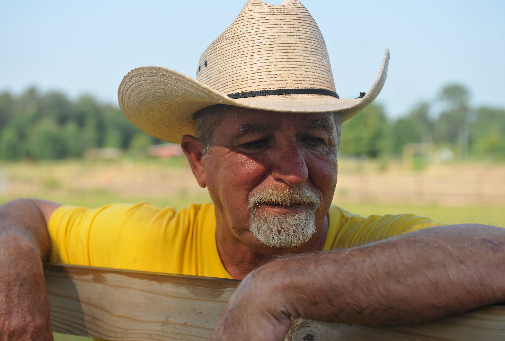 QUITMAN, Ga. -- Mike Randall, Hopes and Dreams Riding Facility owner, takes time to reflect on the progress he and his horses have made with individuals who have brain trauma and post-traumatic stress disorder at the Hopes and Dreams Riding Facility here July 31.  The facility provides more than just horseback riding for veterans; it also offers hunting, fishing, camping and canoeing, free of charge to military members and their families. (U.S. Air Force photo by Airman 1st Class Joshua Green/RELEASED)