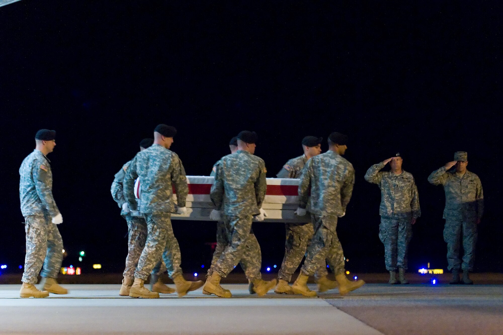 A U.S. Army carry team transfers the remains of Army Staff Sgt. Conrad A. Mora, of San Diego, Calif., at Dover Air Force Base, Del., July 25. Staff Sgt. Mora was assigned to 5th Battalion, 3rd Field Artillery Regiment, 17th Fires Brigade, Joint Base Lewis-McChord, Wash.  (U.S. Air Force photo/Roland Balik)