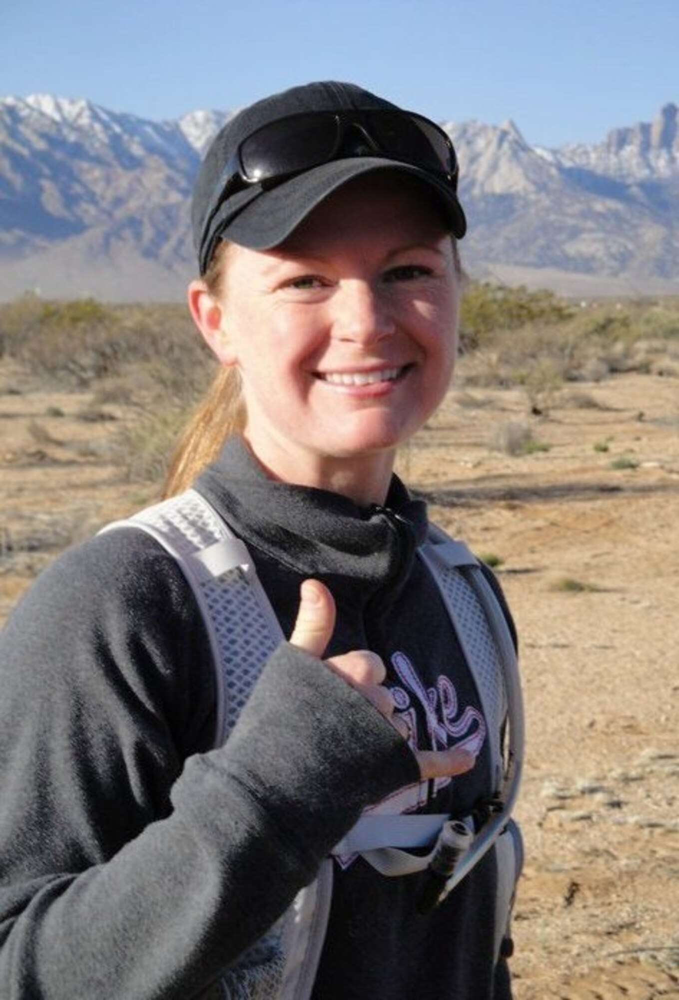 Staff Sgt. Cheryl Moore stops for a quick pose four miles into the Bataan Memorial Death March at White Sands Missile Range, New Mexico. The full course is 26.2 miles and is held in honor of the heroic service members who defended the Philippine Islands during World War II. (Courtesy photo)

