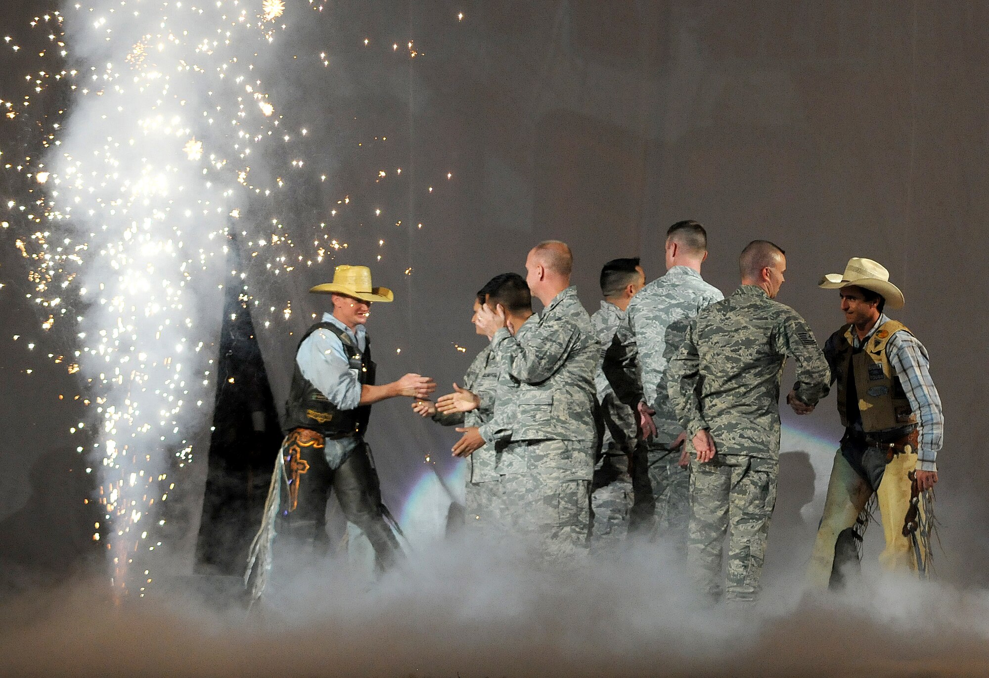 Local Airmen who recently returned from deployments overseas greet bull riders during the Professional Bull Riders United States Air Force Invitational at the AT&T Center July 31. (U.S. Air Force photo by Deborah Silliman Wolfe)