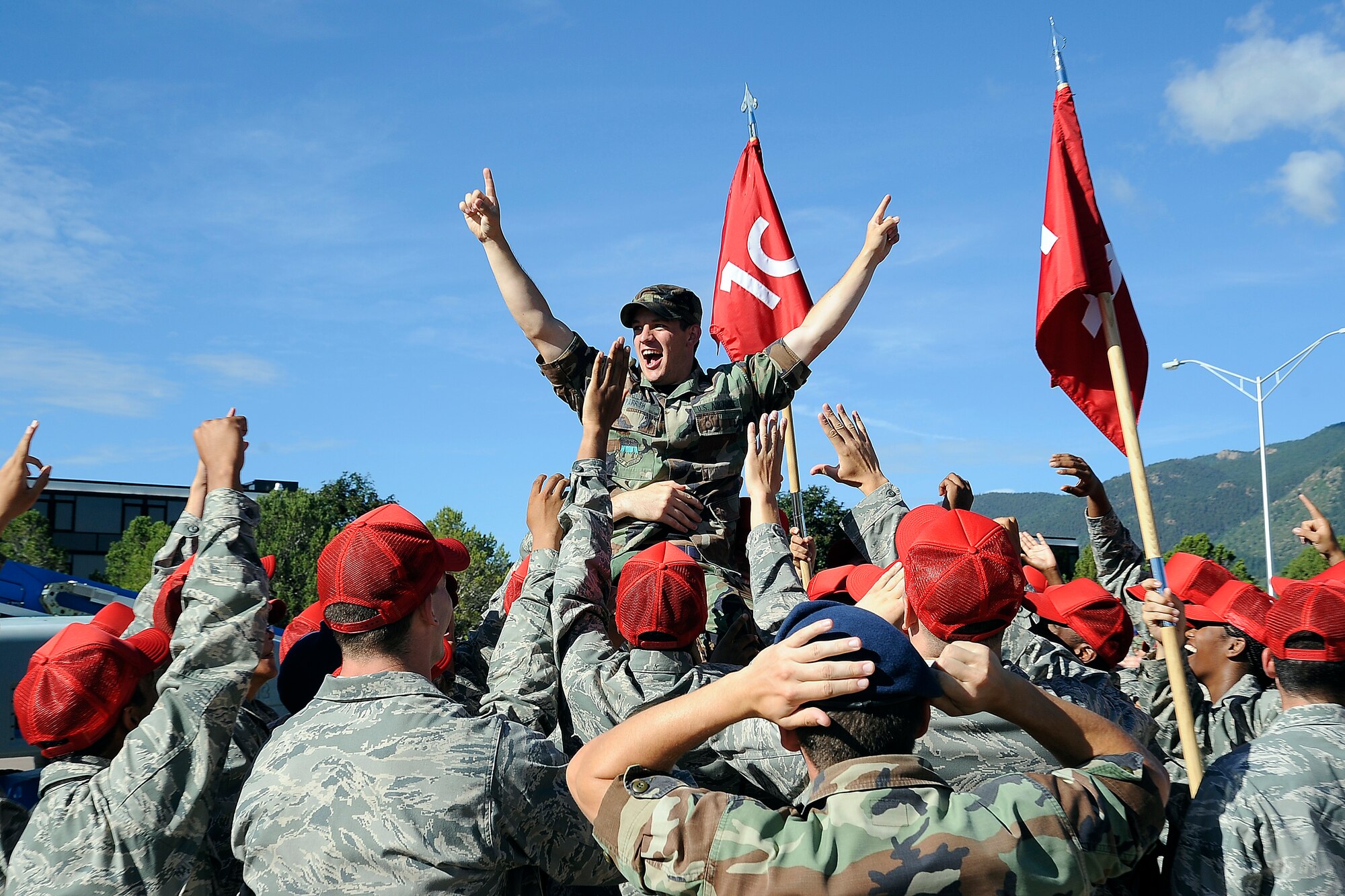 Cadet candidates at the Academy Preparatory School hoist Cadet 1st Class Douglas Parrish onto their shoulders during the Prep School's Acceptance ceremony and celebration July 31, 2010. (U.S. Air Force photo/J. Rachel Spencer)