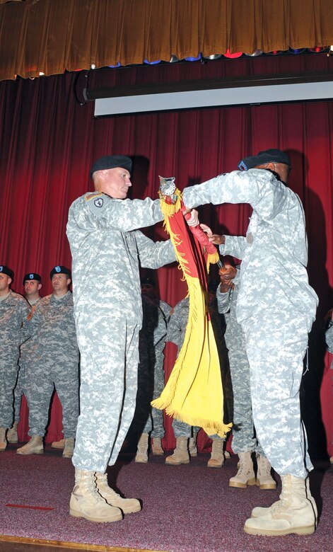 Fort Eustis Commander and Chief of Army Transportation Brig. Gen. Brian R. Layer awards the Legion of Merit medal to 8th Transportation Brigade Commander Col. Daniel M. Georgi during the 8th Trans. Bde. deactivation ceremony July 30 at Wylie Theater, Fort Eustis.
