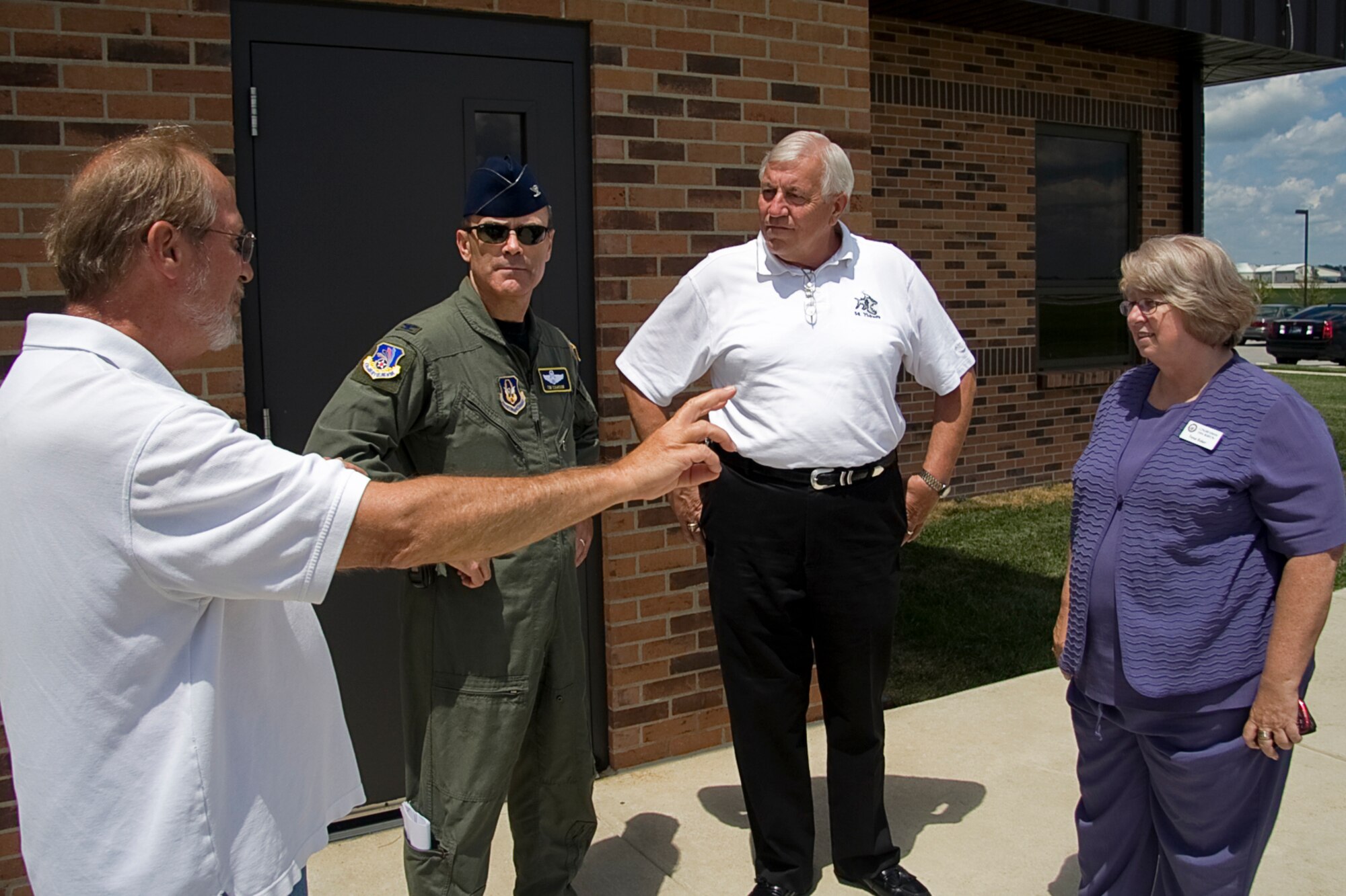 GRISSOM AIR RESERVE BASE, Ind. -- Terry Albaugh, 434th Operations Support Squadron air traffic manager, talks with Col. William T. "Tim" Cahoon, Joe Oyler and Tresa Baker during an elected officials outreach event here recently. Colonel Cahoon is the 434th Air Refueling Wing commander. Mr. Oyler is a military affairs specialist for Congressman Steve Buyer and Mrs. Baker is a special assistant to Congressman Dan Burton. (U.S. Air Force photo/Tech. Sgt. Mark Orders-Woempner)