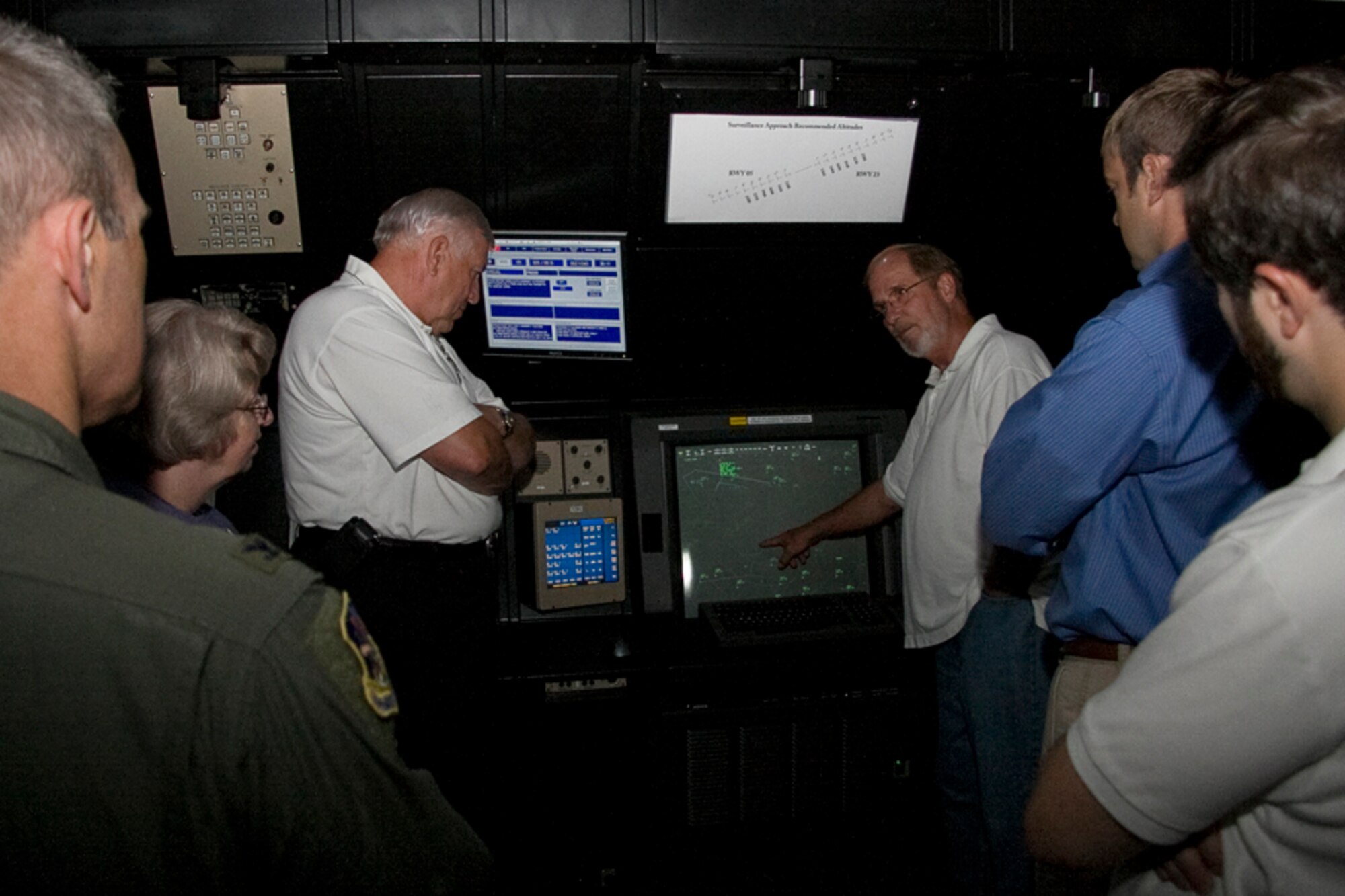 GRISSOM AIR RESERVE BASE, Ind. -- Terry Albaugh, an air traffic manager with the 434th Operations Support Squadron, shows a group of congressional staffers the radar approach control facility here. Included in the group were Joe Oyler, a military affairs specialist for Congressman Steve Buyer; Tresa Baker, a special assistant to Congressman Dan Burton; Eric Woolf, a field representative for Congressman Burton; and Adam Russell, a military affairs caseworker for Congressman Joe Donnelly. Col. William T. "Tim" Cahoon also was present for the demonstration. (U.S. Air Force photo/Tech. Sgt. Mark Orders-Woempner)