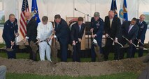 From left to right, Col. Robert H. Edmondson, commander of the Air Force Mortuary Affairs Operations Center, Gerry Byrne, Fisher House Foundation, Ruth Stonesifer, national president of the Gold Star Mothers of America, Michael B. Donley, secretary of the Air Force, Kenneth Fisher, Fisher House Foundation chairman, Gen. Norton A. Schwartz, Air Force chief of staff, David Coker, Fisher House Foundation president, Carl Zarrello, Fisher House Foundation, and Col. Manson Morris, commander of 436th Airlift Wing, turn shovels filled with soil in a groundbreaking ceremony May 1 for a new Fisher House at Dover Air Force Base, Del. This Fisher House is the first to be built and dedicated to provide hospice services to the families of fallen servicemembers. (U.S. Air Force photo/Roland Balik) 