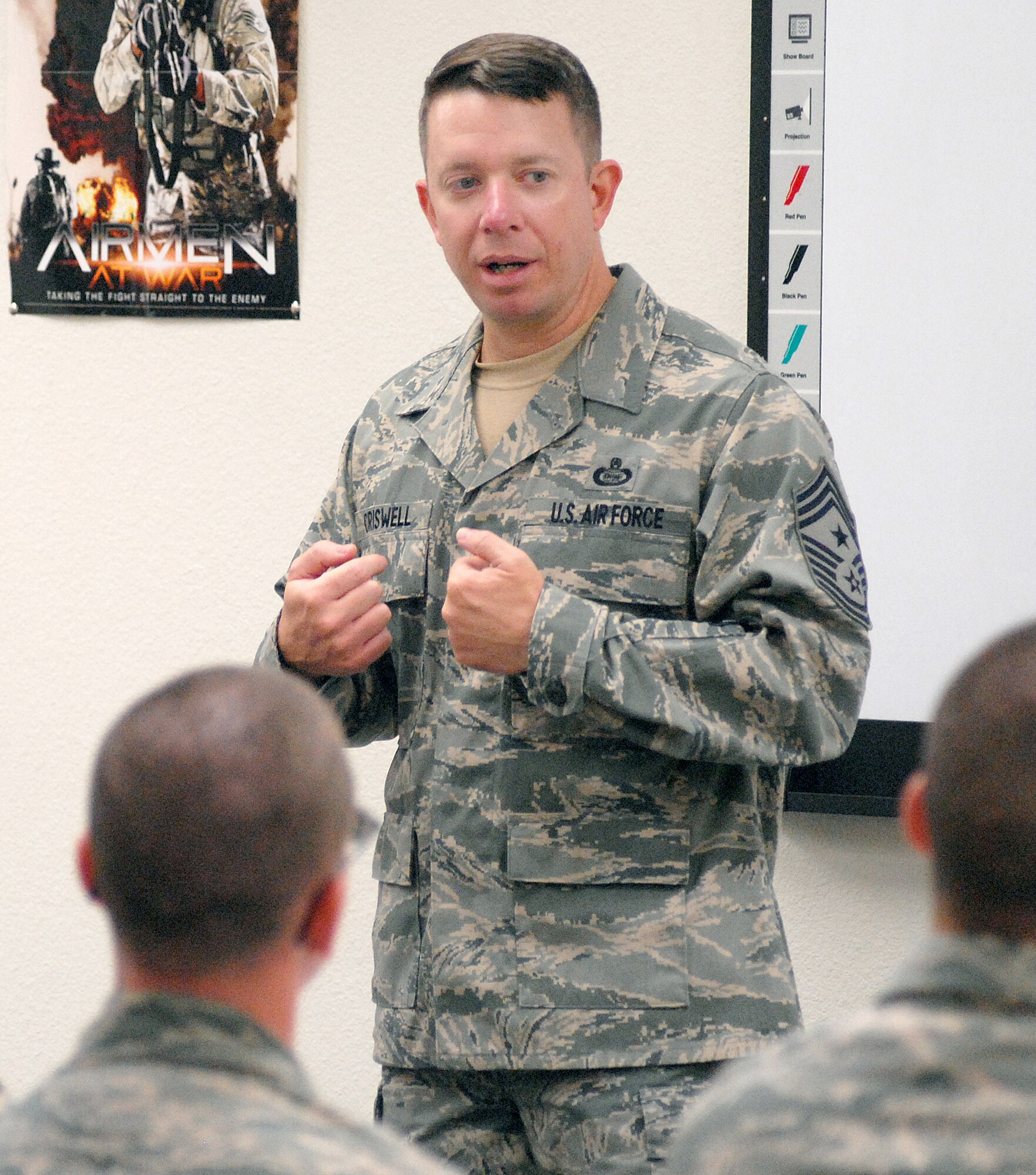 17th Training Wing Command Chief Master Sgt. Brendan Criswell talks to a group of Airmen on the keys to being successful in today’s Air Force Aug. 3. Each week Chief Criswell speaks to Airmen fresh from Basic Military Training as part of their orientation to technical training at Goodfellow. (U.S. Air Force photo/Master Sgt. Randy Mallard)