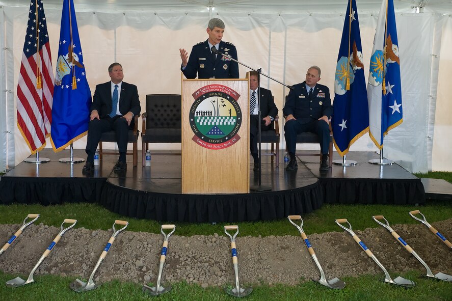 Gen. Norton A. Schwartz, Air Force chief of staff, speaks to the attendees of the groundbreaking ceremony May 1, 2010 for the new Fisher House and meditation pavilion for the families of the fallen at Dover Air Force Base, Delaware, along with Michael B. Donley, secretary of the Air Force, Kenneth Fisher, Fisher House Foundation chairman, and Col. Robert H. Edmondson, commander of the Air Force Mourtuary Affairs Operations Center, which provides comfort for those awaiting the return of their fallen family members from overseas. (U.S. Air Force photo/Roland Balik)