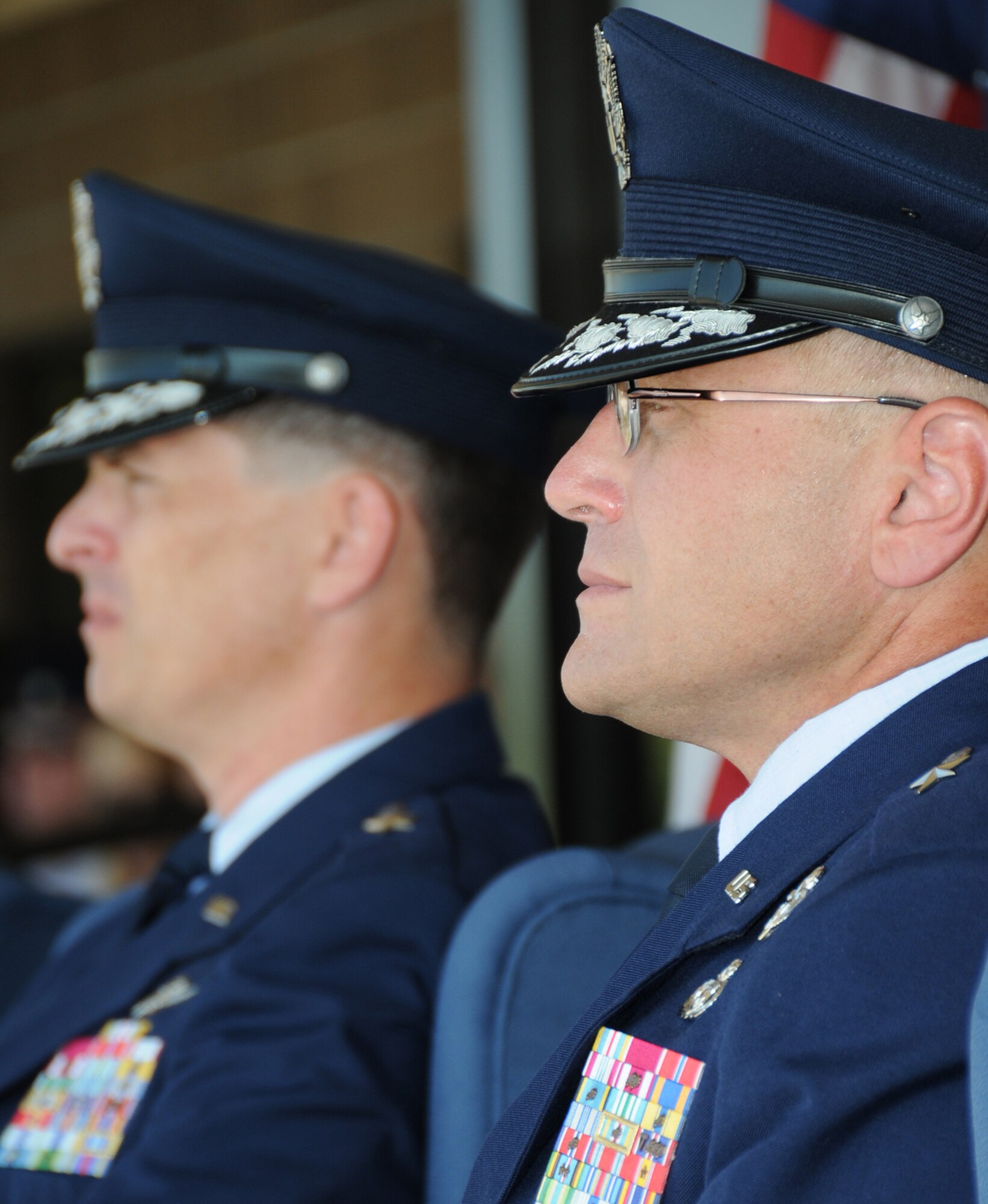 Brig. Gen. Ian Dickinson, left, prepares to relinquish command of the 81st Training Wing to Brig. Gen. Andrew Mueller during Monday’s ceremony on the parade field.  Maj. Gen. Mary Kay Hertog, 2nd Air Force commander, officiated.  General Mueller comes to Keesler from Eskisehir, Turkey, where he was the deputy commander for NATO’s Combined Air Operations Center 6, Allied Air Forces Southern Europe.  General Dickinson will serve as Director, Communications and Information, and Chief Information Officer for Air Force Space Command.  (U.S. Air Force photo by Kemberly Groue)