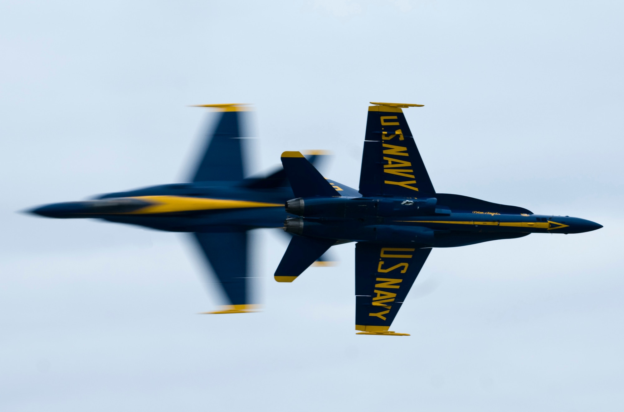 JOINT BASE ELMENDORF-RICHARDSON, Alaska -- Two Boeing F/A-18 Hornets from the U.S. Navy Blue Angels pass by each other in a move called the "Knife Edge" during their performance at Joint Base Elmendorf-Richardson's Arctic Thunder Aug. 1. Arctic Thunder 2010, a two-day event featured the Blue Angels and the Canadian Forces Snowbirds Demonstration Team, along with many other aerial demonstrations and static displays. (Air Force photo by Airman 1st Class Christopher Gross) 