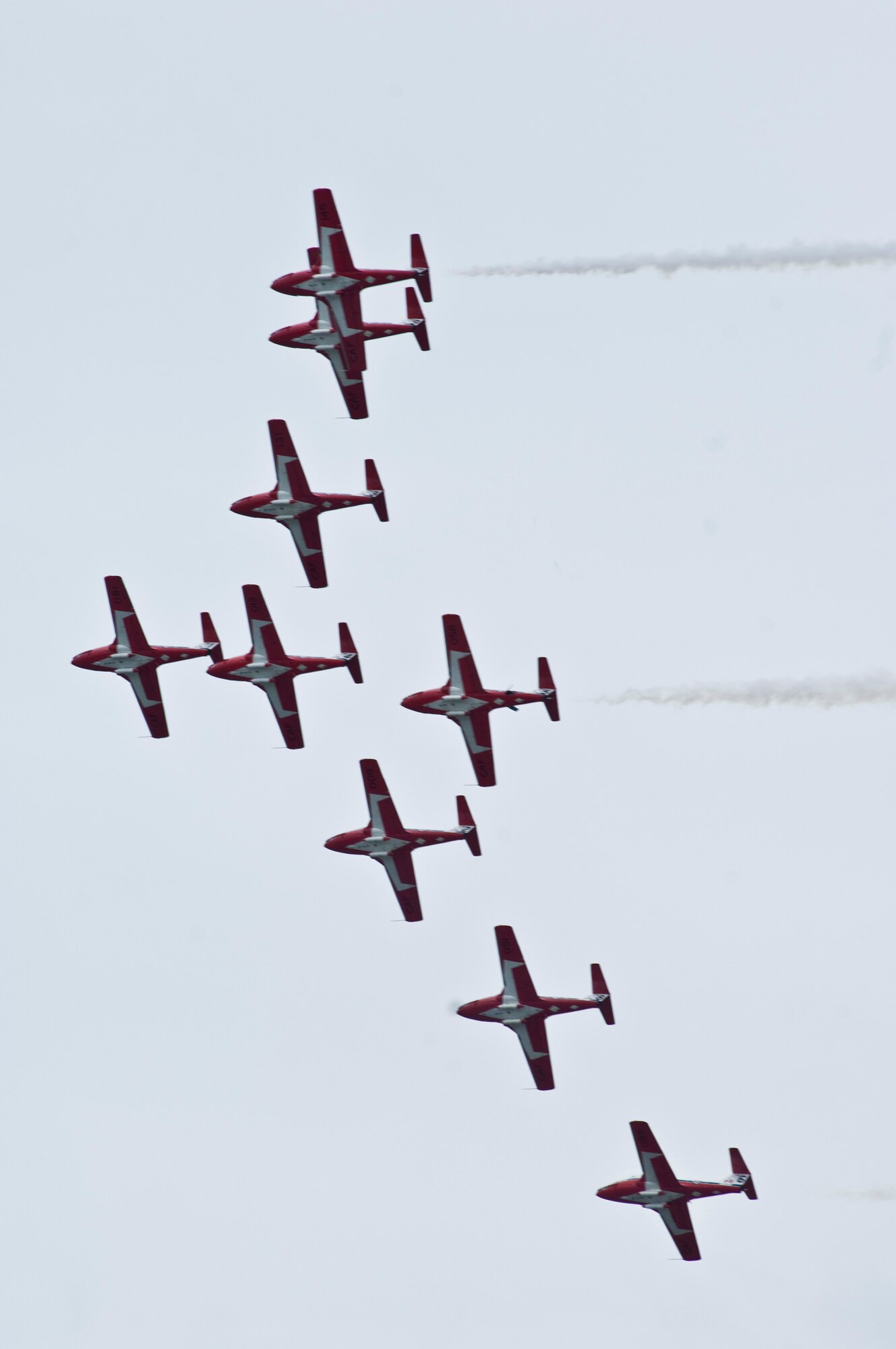 JOINT BASE ELMENDORF-RICHARDSON, Alaska -- A formation of the Canadian Snowbirds Demonstration Team, CT-114 Tutor jets, flies over the crowd during Joint Base Elmendorf-Richardson's Arctic Thunder Aug. 1. Arctic Thunder 2010, a two-day event, featured the U.S. Navy Blue Angels and the Canadian Forces Snowbirds Demonstration Team, along with many other aerial demonstrations and static displays. (Air Force photo by Airman 1st Class Christopher Gross) 