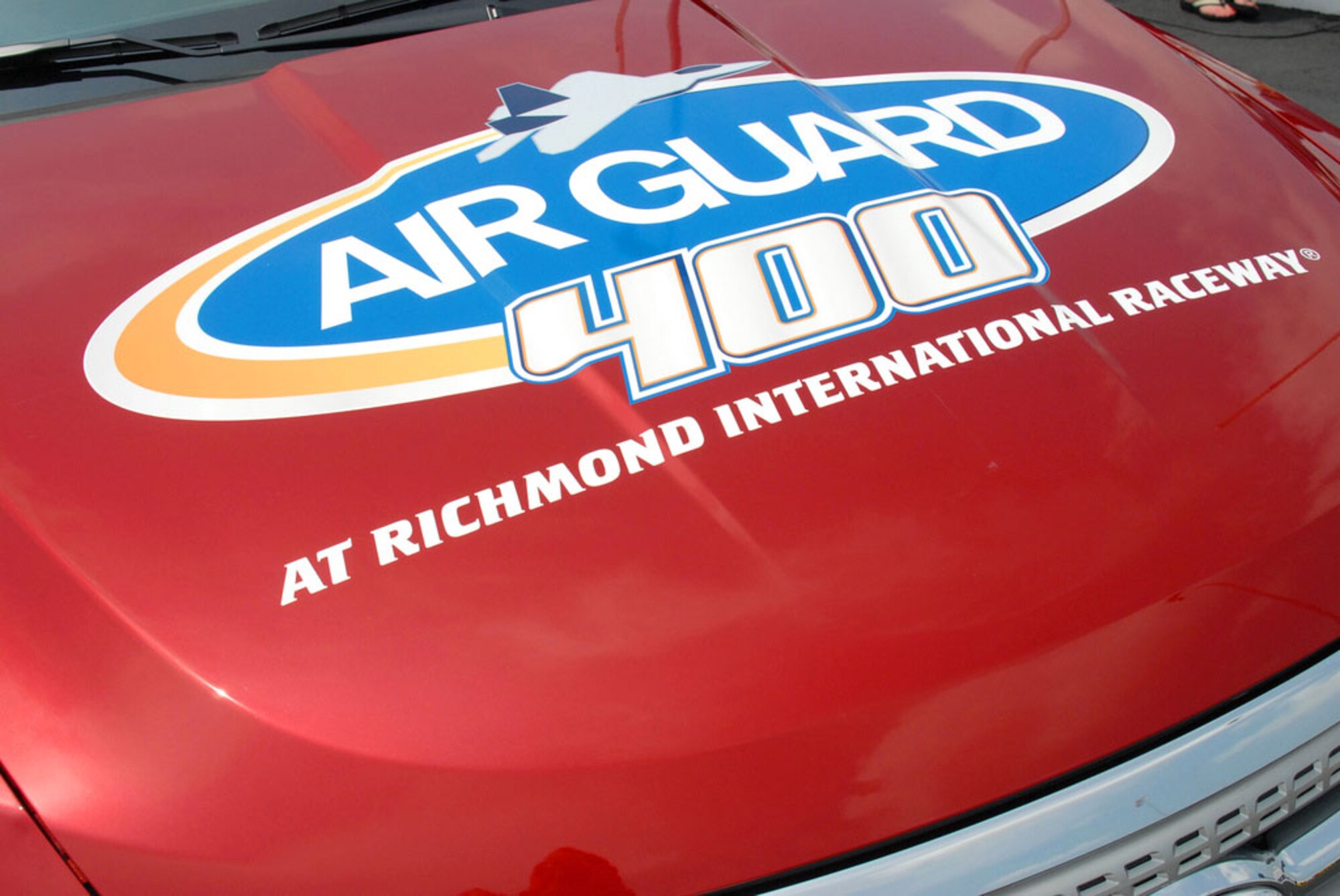 The official pace car was unveiled for the Air Guard 400, which will be held Sept. 11, 2010, at the Richmond International Raceway in Richmond, Va. The announcement of the race's new sponsor was made at the track after a skydiving stunt by Master Sgt. Matt Leas and Doug Fritz, the track president, Aug. 4, 2010. (Photo/Army Staff Sgt. Andrew H. Owen)