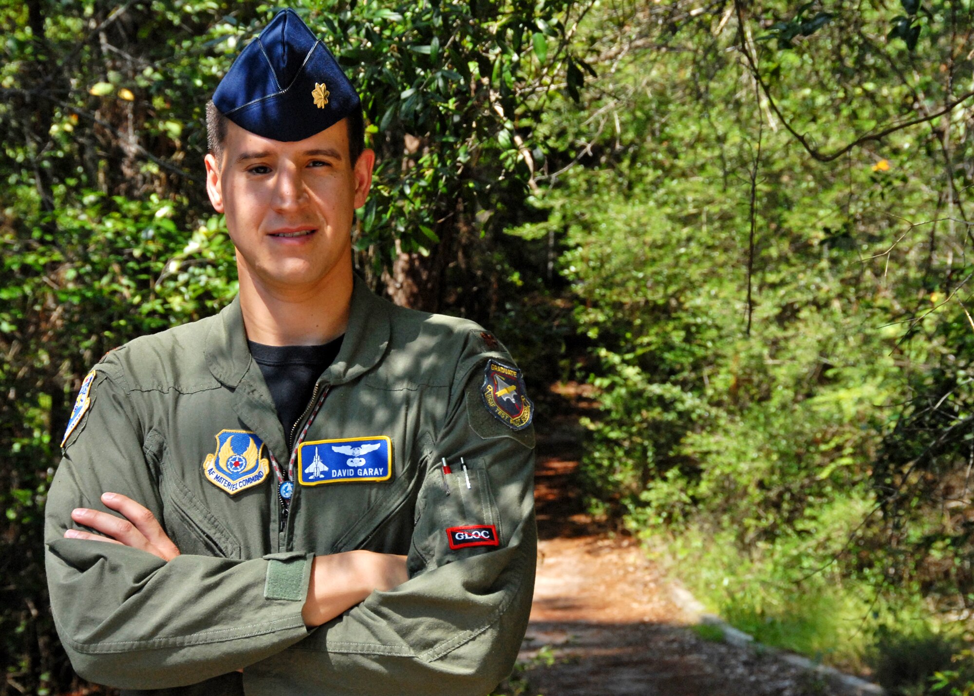 Maj. David Garay, Air Armament Center executive officer, survived a 50-foot fall during a hike while he was a cadet at the Air Force Academy. Although bones were broken in his face, he tried to climb down to get help. The head trauma he suffered almost cost him his dream of flying for the Air Force, but he overcame it all to become a flight test engineer. (U.S. Air Force photo/Samuel King Jr.)
