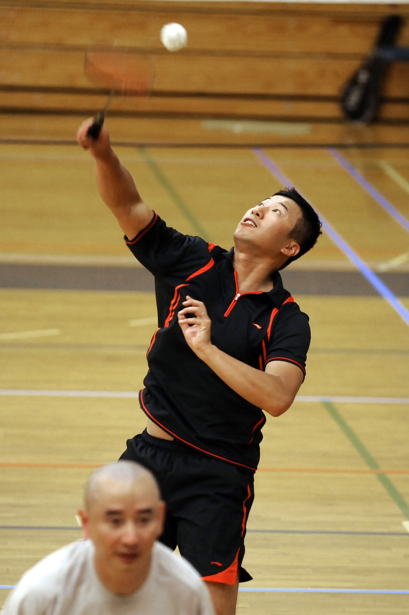 Qin Zhu and Qun Miao play in a badminton competition at Air Academy High School Aug. 1, 2010, during the Rocky Mountain State Games at the Air Force Academy and in Colorado Springs, Colo. Zhu, a faculty member with the University of Wyoming's Department of Kinesiology and Health, placed second in the Class A men's singles competition. (U.S. Air Force photo/Mike Kaplan)
