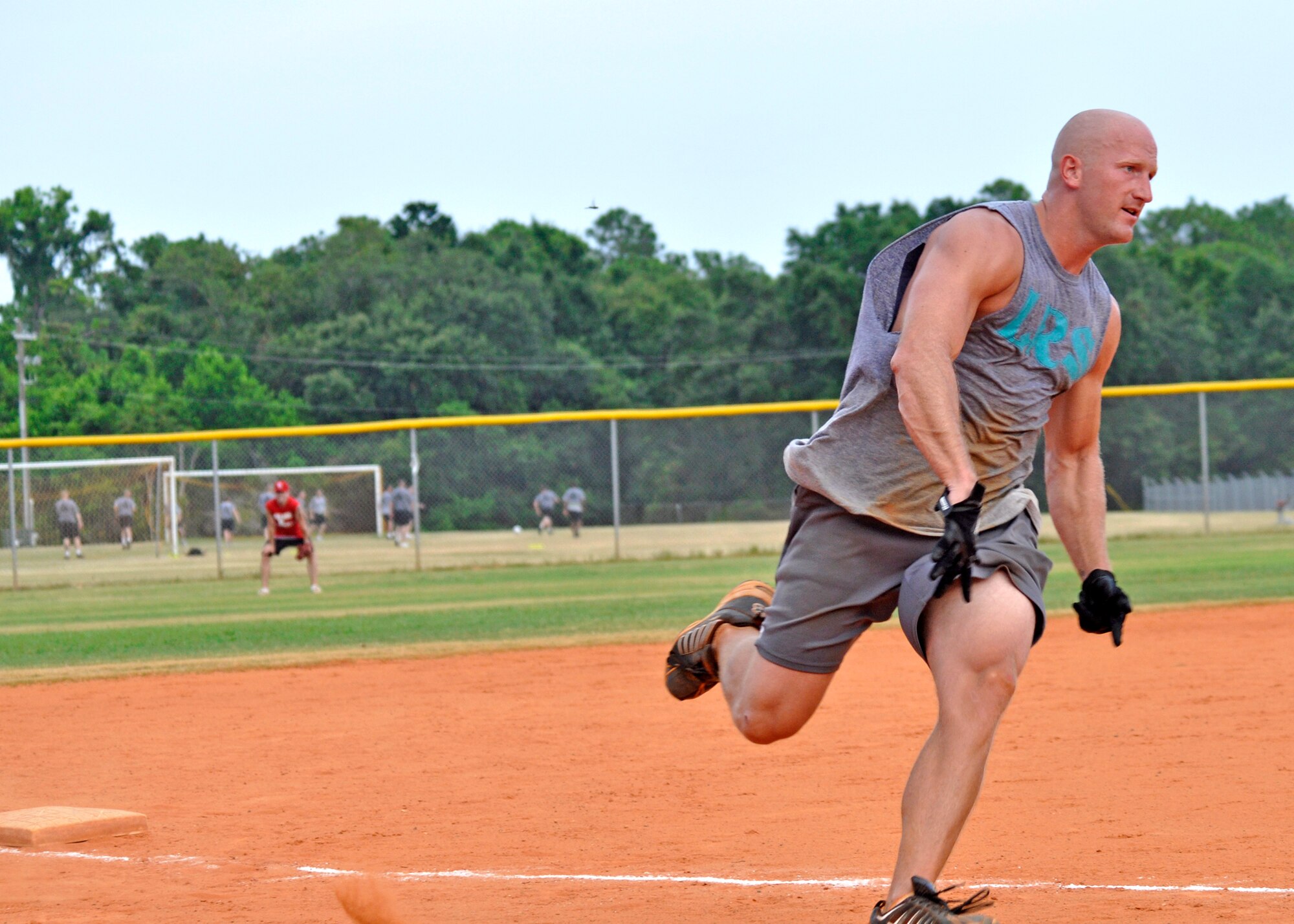 Grant Gammon, 96th Logistics Readiness Squadron, sprints for home during the base intramural softball championship Aug. 2 at Eglin’s Foster Stadium.  The 96th Logistics Readiness Squadron team came up from the losers’ bracket to defeat MDG twice to claim the title in the double elimination tournament.  Coach Tim Sandlin called Gammon the most valuable player on the team.  “His offense kept us in every game and defense never let us down,” said the coach. Both games were won by only one run, which was scored in the bottom of the final inning.  (U.S. Air Force photo/Tech. Sgt. Cheryl Foster.)