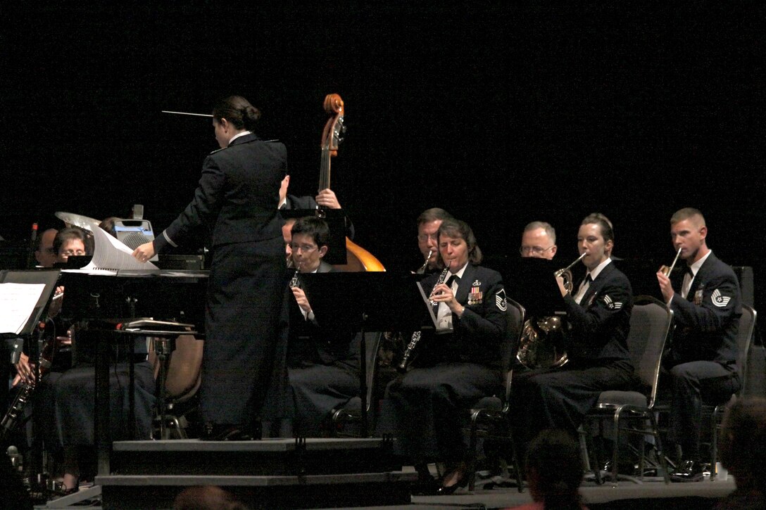 Captian Cristina Moore Urrutia conducts the Concert Band at the 2010 Texas Bandmasters Association Convention performance.