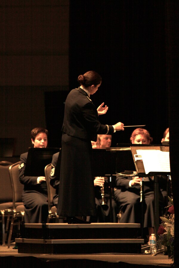 Captian Cristina Moore Urrutia conducts the Concert Band at the 2010 Texas Bandmasters Association Convention performance