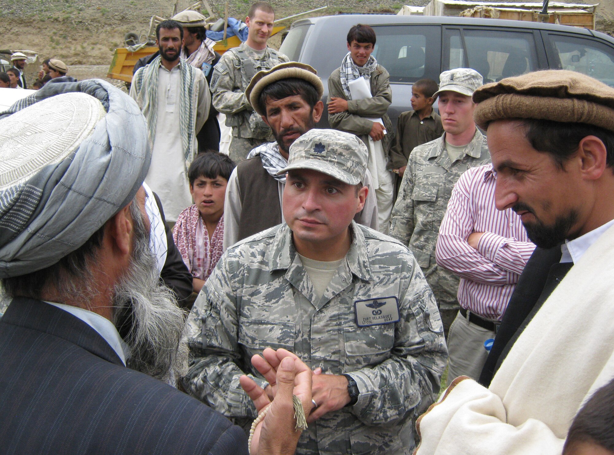 U.S. Air Force Lt. Col. Curtis Velasquez, Provincial Reconstruction Team Panjshir commander and Abilene, Kan., native, talks to a village elder after a ribbon-cutting ceremony for the Paryan Justice Center Aug. 2. Velasquez said the cooperation between the Panjshiris and PRT makes a lot of quality projects attainable. (Photo by U.S. Air Force 2nd Lt. Jason Smith, PRT Panjshir Public Affairs)