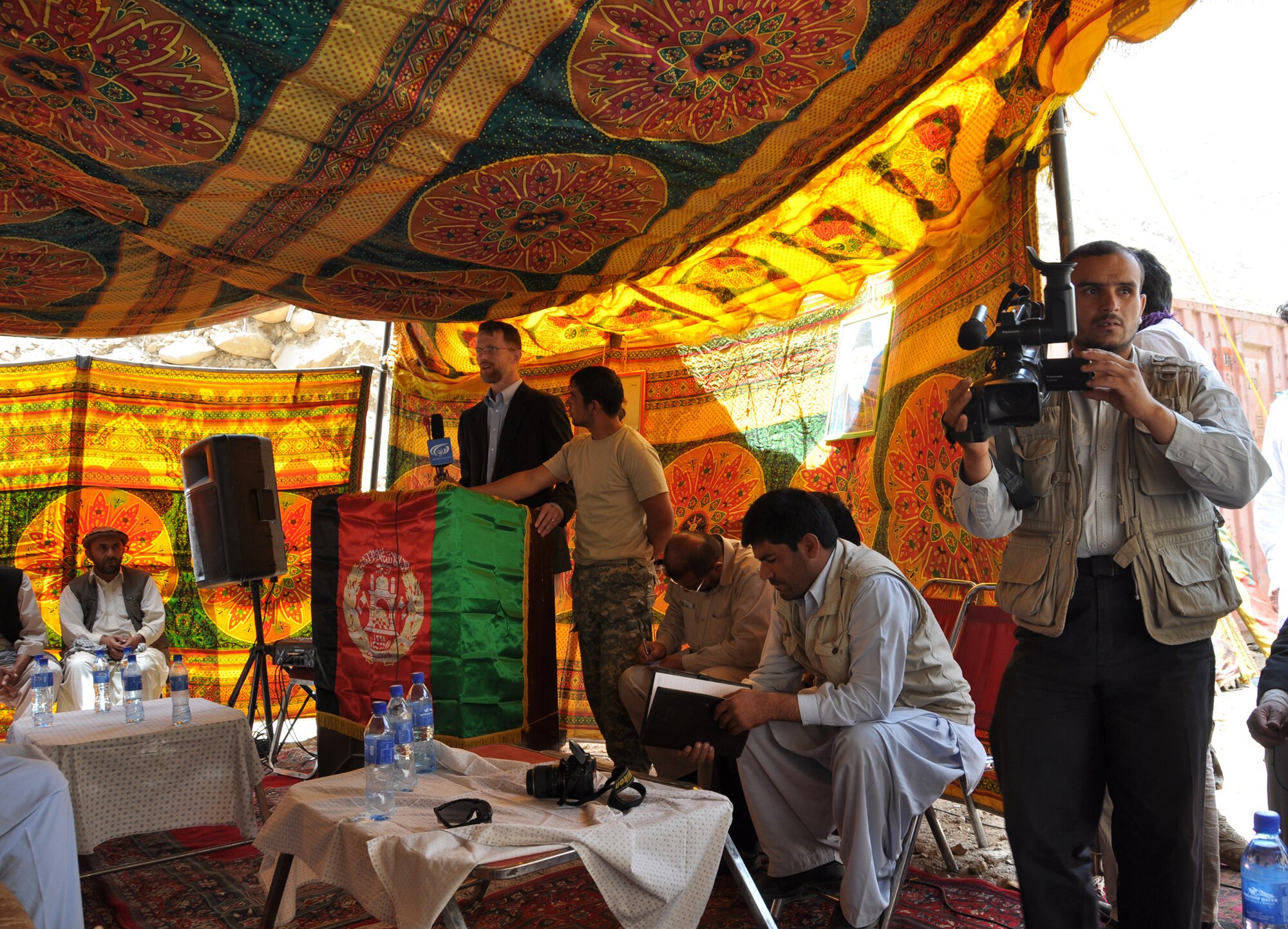 Bill Martin, U.S. Department of State and Provincial Reconstruction Team Panjshir director, gives a speech during a ribbon-cutting ceremony in the Paryan District of the Panjshir Province, Afghanistan. The group formally opened construction July 19 on Section 3.5 of the only main road running through the valley. (Photo by U.S. Air Force 1st Lt. Holly A. Hess, PRT Panjshir Public Affairs)