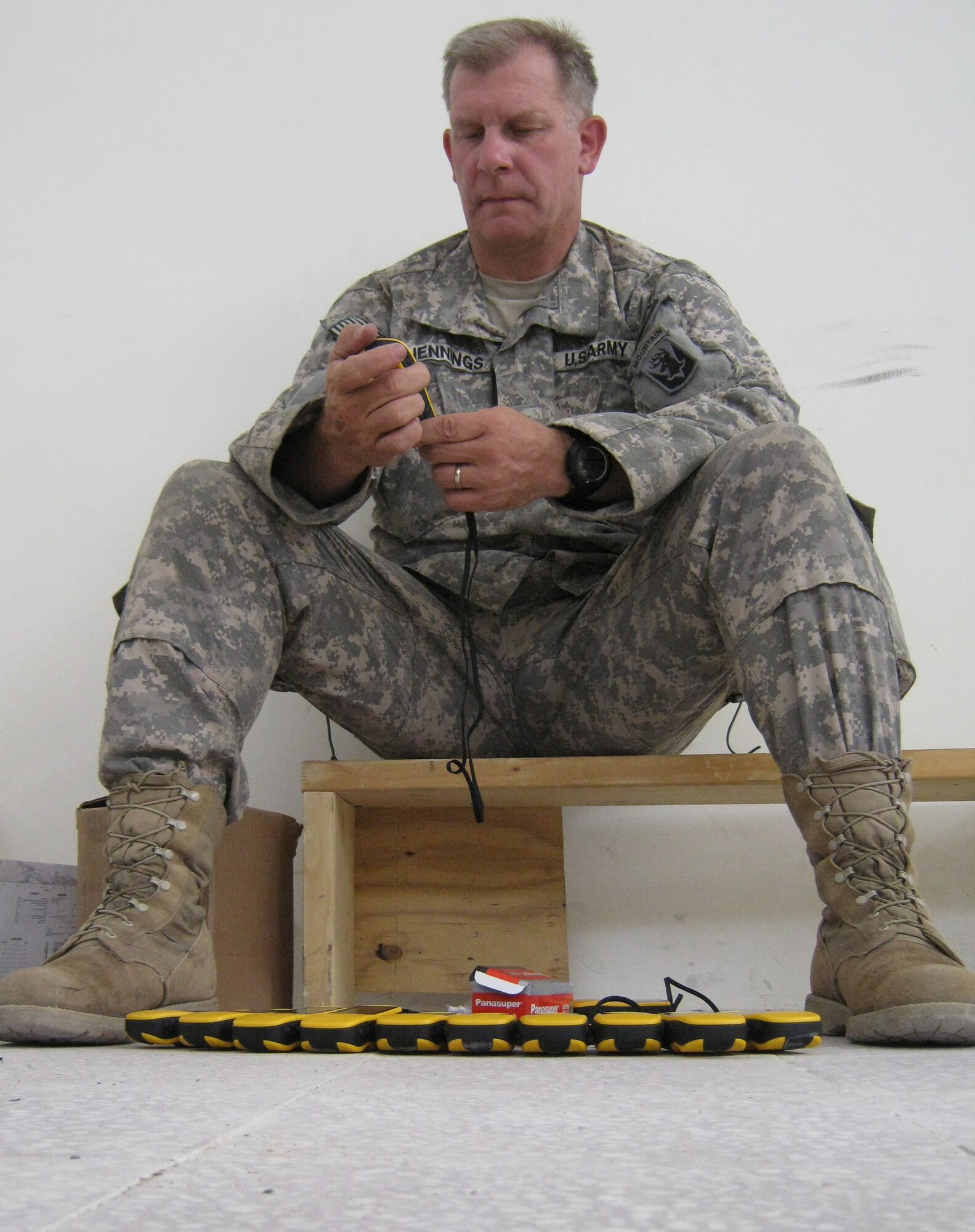 U.S. Army Sgt. 1st Class Stephen Jennings, Task Force Wolverine Embedded Training Team with Provincial Reconstruction Team Panjshir, function checks GPS units for a GPS class at the Rokha District Police Headquarters in the Panjshir Province of Afghanistan. Jennings and the rest of the ETT are able to sit in the back of the classroom while an Afghan National Police captain teaches other ANP members map and compass techniques. Jennings said the response from the ANP students has been ?overwhelming.? (Photo by U.S. Air Force 2nd Lt. Jason Smith, PRT Panjshir Public Affairs)