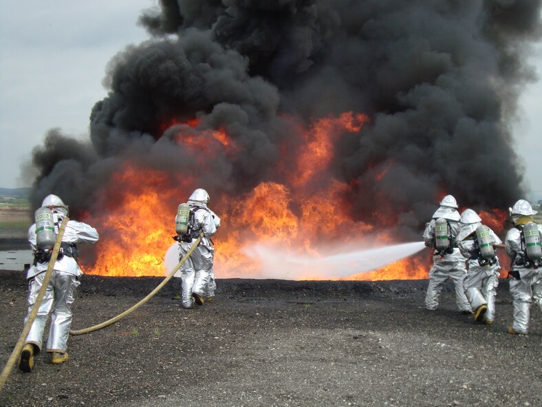 Firefighters from Osan's 51st Civil Engineer Squadron participate in joint live fire training at Camp Humphreys July 20. (U.S. Air Force photo/Master Sgt. Kevin Walker)