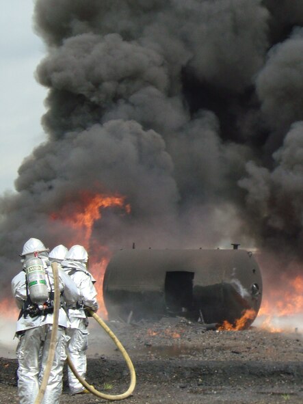 Firefighters from Osan's 51st Civil Engineer Squadron participate in joint live fire training at Camp Humphreys July 20. (U.S. Air Force photo/Master Sgt. Kevin Walker)