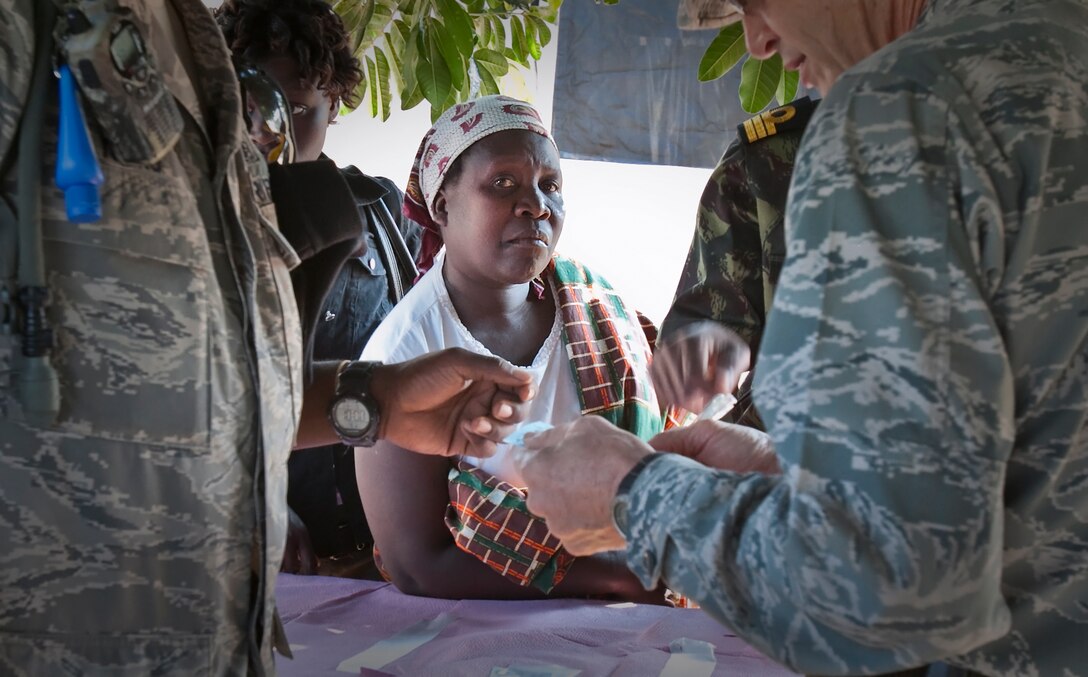 U.S. Air Force medical personnel prepare a prescription for a Mozambican woman during a medical engagement in Tenga, Mozambique, Aug. 5, 2010. Service members set up a satellite medical facility here as part of Exercise Shared Accord 2010, a 10-day exercise designed to build U.S. Africa Command partner nation capacity for peace and stability operations. The SA10 task force of more than 700 service members will also be working to provide humanitarian civic-assistance and engineering projects.