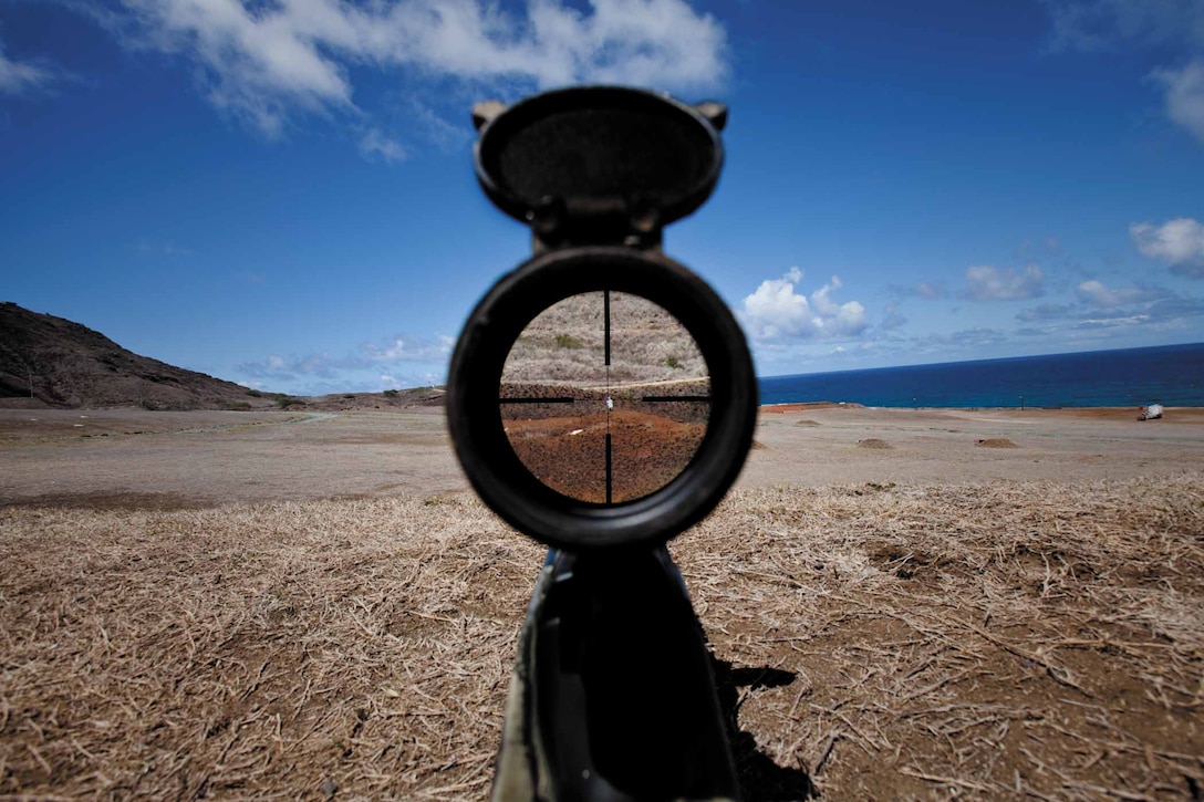 Students with the Scout Sniper School, School of Infantry West, Detachment Hawaii, used the mil-dot reticle pattern in the scopes of their M40A series sniper rifles to measure targets and approximate range during an unknown distance qualification course at Range Training Facility Kaneohe Bay on Marine Corps Base Hawaii Aug. 5. The mil-dot pattern is utilized when laser range finders are nonfunctioning or unable to be utilized. “Snipers have to be able to calculate unknown distance without a laser range finger so they know the basics and are still able to function if it isn’t working,” said Sgt. Brandon A. Standridge, an instructor with the Scout Sniper School, School of Infantry West, Detachment Hawaii.