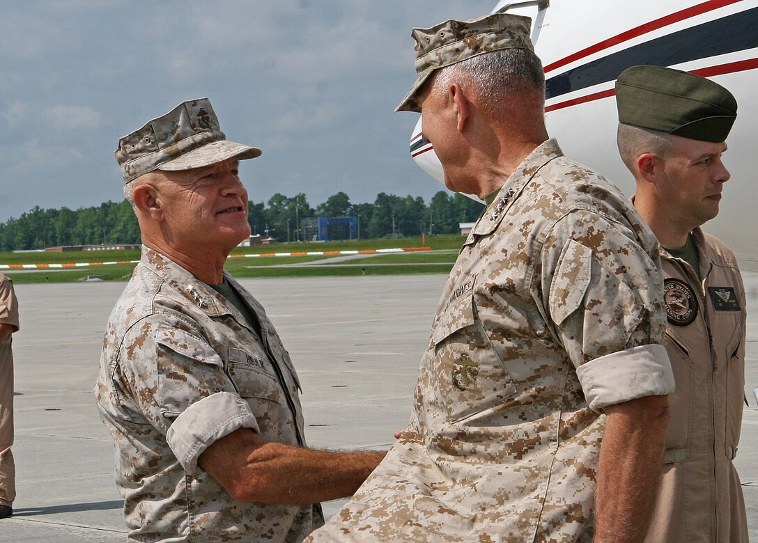 Lt. Gen. Dennis J. Hejlik (left), commanding general of II Marine Expeditionary Force, greets Gen. James T. Conway, Commandant of the Marine Corps, as he arrives aboard Marine Corps Air Station New River, N.C., Aug. 5, 2010. Conway, accompanied by Sgt. Maj. Carlton W. Kent, Sergeant Major of the Marine Corps, toured Marine Corps bases and air stations along the East Coast Aug. 4-6, and took the opportunity to hold town hall-style meetings with the Marines and sailors stationed there.
