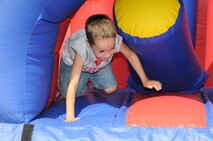 A family member plays in the giant boucny house at the 916th's annual Family Day picnic in 2009. (USAF photo by MSgt. Gillian Albro, 916MSF)