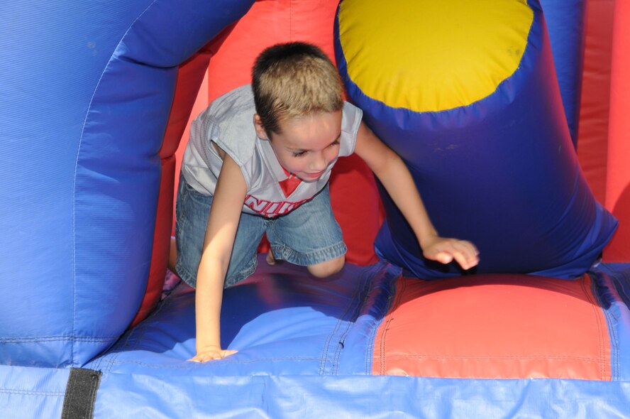 A family member plays in the giant boucny house at the 916th's annual Family Day picnic in 2009. (USAF photo by MSgt. Gillian Albro, 916MSF)