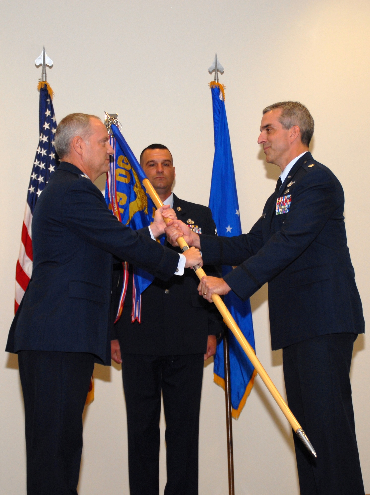 Col. David A. Kasberg (left), 19th Operations Group commander, Little Rock Air Force Base, Ark., presents the 345th Airlift Squadron guidon to Lt. Col. Craig L. Williams, 345th AS commander, during an assumption of command ceremony at Keesler Air Force Base, Miss. Aug. 6. The 345th was reactivated making it the third Active Associate squadron assigned to the 19th Airlift Wing, Little Rock Air Force Base, Ark., and the first ever C-130J Total Force Initiative squadron. (U.S. Air Force photo by Capt. Joe Knable)