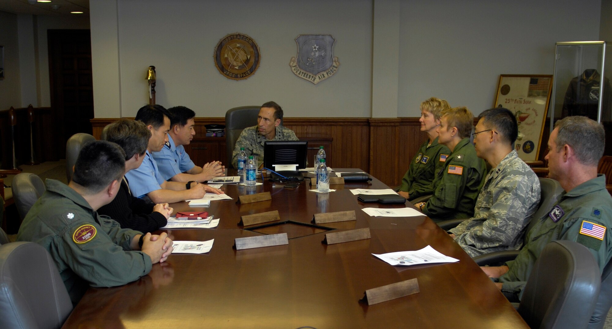 VANDENBERG AIR FORCE BASE, Calif. – During a visit to the base, Korean Air Force Maj. Gen. Sin-Kyu Park, and his interpreter Korean Air Force Lt. Col. Hak Chang Kim, meet with the Joint Functional Component Command for Space for a briefing here Thursday, Aug. 5, 2010. General Park and Colonel Kim came to learn about the Joint Space Operations Center, tour Space Launch Complex-6 and learn about JFCC Space. (U.S. Air Force photo/Airman 1st Class Lael Huss)