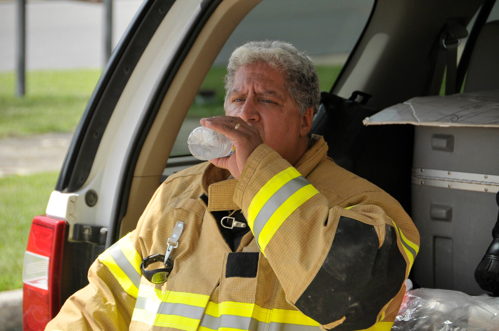 AEDC Fire Chief Daryle Lopes rehydrates after tackling the stairs at the Mark 1 space test facility to practice for the Nashville Stair Climb. (Photo by: Rick Goodfriend)